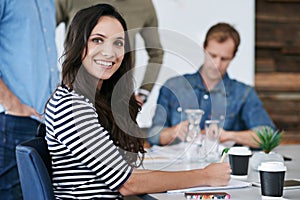 Portrait, woman and meeting at startup with notes, creative brainstorming with team or workshop for ideas. Professional