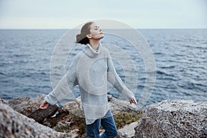 portrait of a woman nature rocks coast landscape Ocean female relaxing