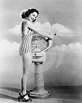 Portrait of woman operating boat controls photo