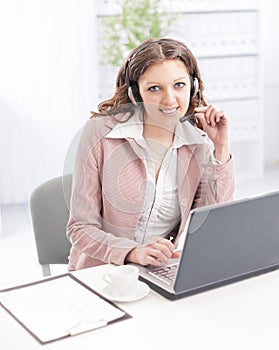 Portrait of a woman operator of a call center