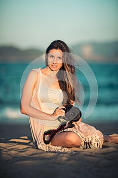 Portrait of a woman photographer with camera