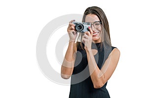 Portrait of woman photographer with retro photo camera
