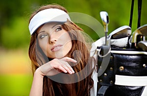 Portrait of a woman playing golf on a green