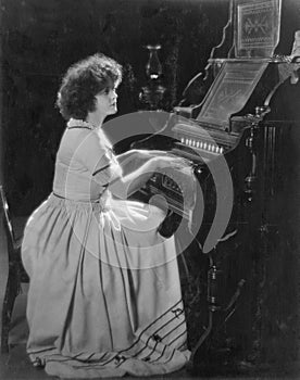 Portrait of woman playing organ