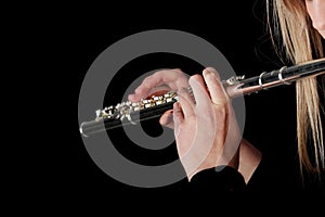 Portrait of a woman playing transverse flute