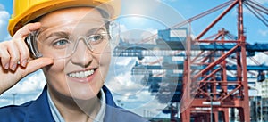 Portrait of woman port manager in helmet and eyeglasses