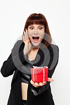 portrait of a woman posing with red gift box surprise  background