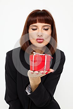 portrait of a woman posing with red gift box surprise  background