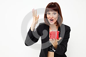 portrait of a woman posing with red gift box surprise  background