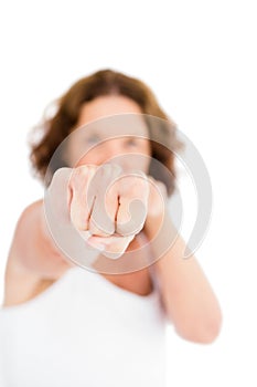Portrait of woman punching