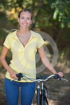 Portrait woman with pushbike photo