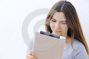 Portrait of a woman reading a tablet ebook