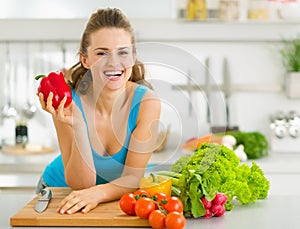 Portrait of woman ready to make vegetable salad