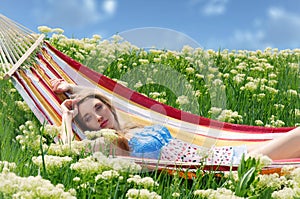 Portrait of woman resting in a hammock