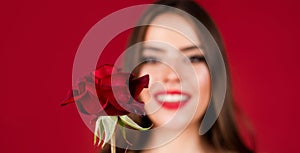 Portrait of a woman with a rose flower. Beauty fashion model woman face. Portrait woman with red rose flowers, banner.