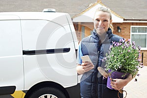 Portrait Of Woman Running Mobile Gardening Business Using Mobile