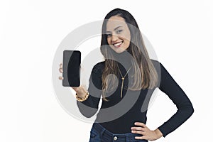 Portrait of a woman showing a blank smartphone screen against a white background