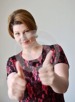 Portrait of woman showing gesture that everything is fine