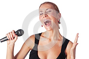Portrait of woman singing with a microphone