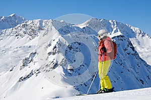 Portrait of a woman skier with colorful sport clothing at Arosa Lenzerheide resort, Switzerland. Space for text, copy space