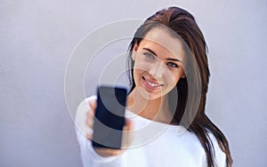 Portrait, woman and smartphone with screen in studio for connectivity, communication and mobile with technology. Female