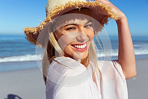 Portrait of woman smiling on the beach