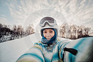 Portrait of woman on a snow-covered ski slope