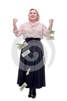 Portrait of woman standing with open arms amidst falling money