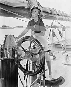 Portrait of woman steering boat