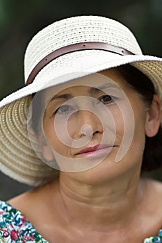 Portrait of a woman in a straw hat