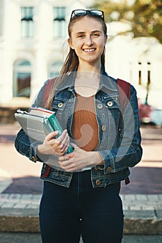 Portrait, woman student or holding books with smile, ready for class or confident for studies. Course, young female or