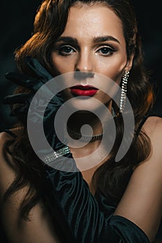 Portrait of a woman in the style of a classic retro Hollywood movie of the 1950s. Elegant young girl with a stylish