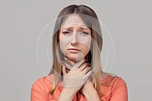 Portrait of woman suffering from cold, flu, sickness with sore throat inflammation, woman health care. Medical concept
