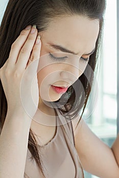 Portrait of woman suffers from headache, migraine, stress