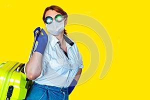 Portrait of woman in sunglasses and medical mask on yellow background. Tourism 2020 concept.