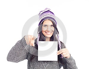 Portrait of woman with a sweater and Peruvian hat woolen holding sign card . white background . isolated