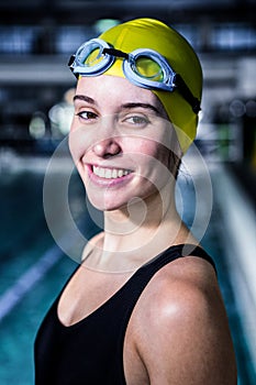 Portrait of a woman swimmer looking the camera