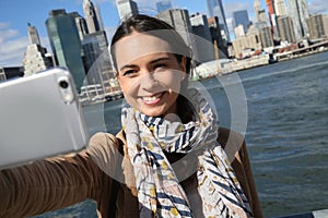 Portrait of woman taking selfie in manhattan