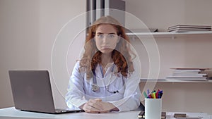 Portrait woman talking in hospital.