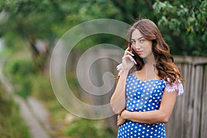 Portrait of woman talking on smart phone.Cropped image of young