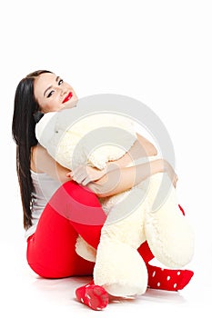 Portrait of a woman with a teddy bear.