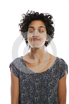 Portrait of woman toughing nose with tongue