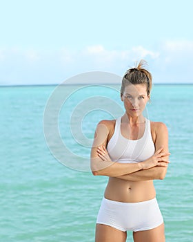 Portrait of a woman in the training suit at the seaside