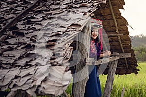 Portrait of Woman Tribal Lisu in Traditional Clothing and Jewelry Costume in Cottage., Lifestyle of Hill Tribe Girl in The North