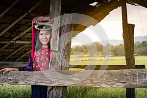 Portrait of woman tribal Lisu in traditional clothing and jewelry costume in cottage., Lifestyle of hill tribe girl in the north
