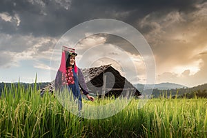 Portrait of Woman Tribal Lisu in Traditional Clothing and Jewelry Costume in Rice Fields., Lifestyle of Hill Tribe Girl in The