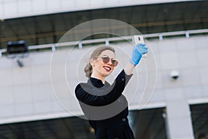 Portrait of a woman using cell phone, clubhouse