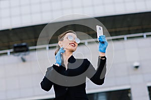 Portrait of a woman using cell phone, clubhouse