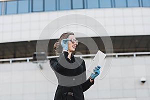Portrait of a woman using cell phone, clubhouse