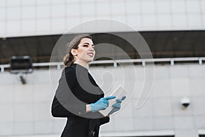 Portrait of a woman using cell phone, clubhouse